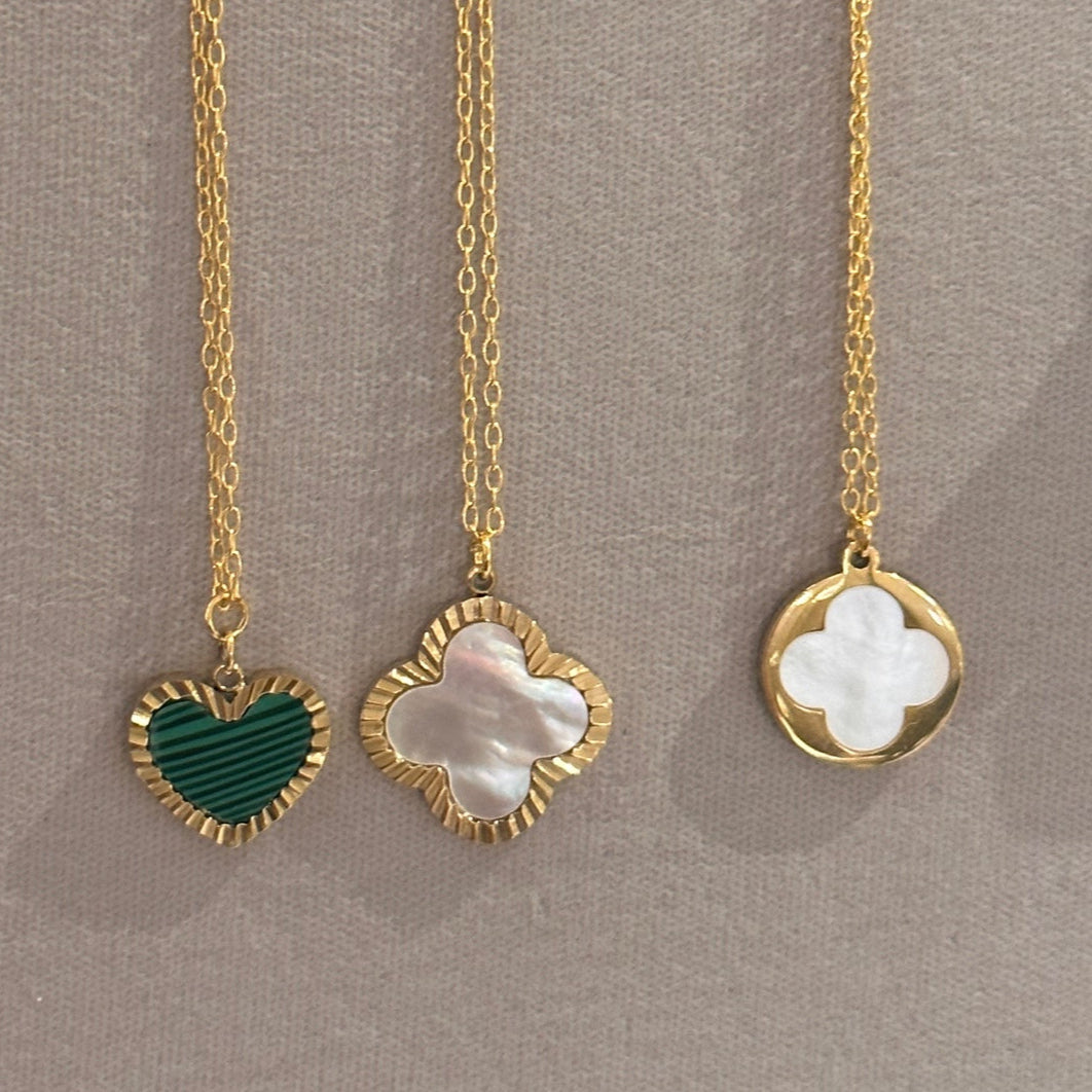 Delicate gold chain necklaces with charms