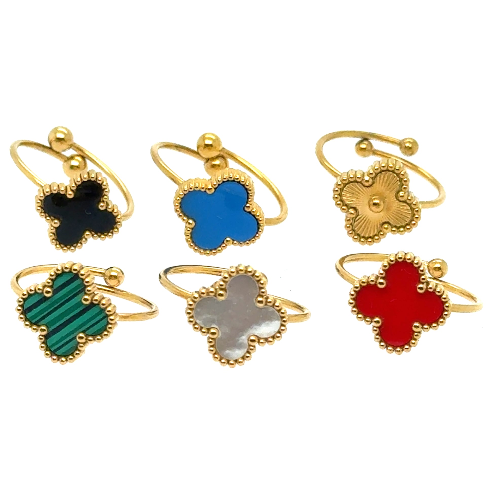 six gold rings with different colour clover designs