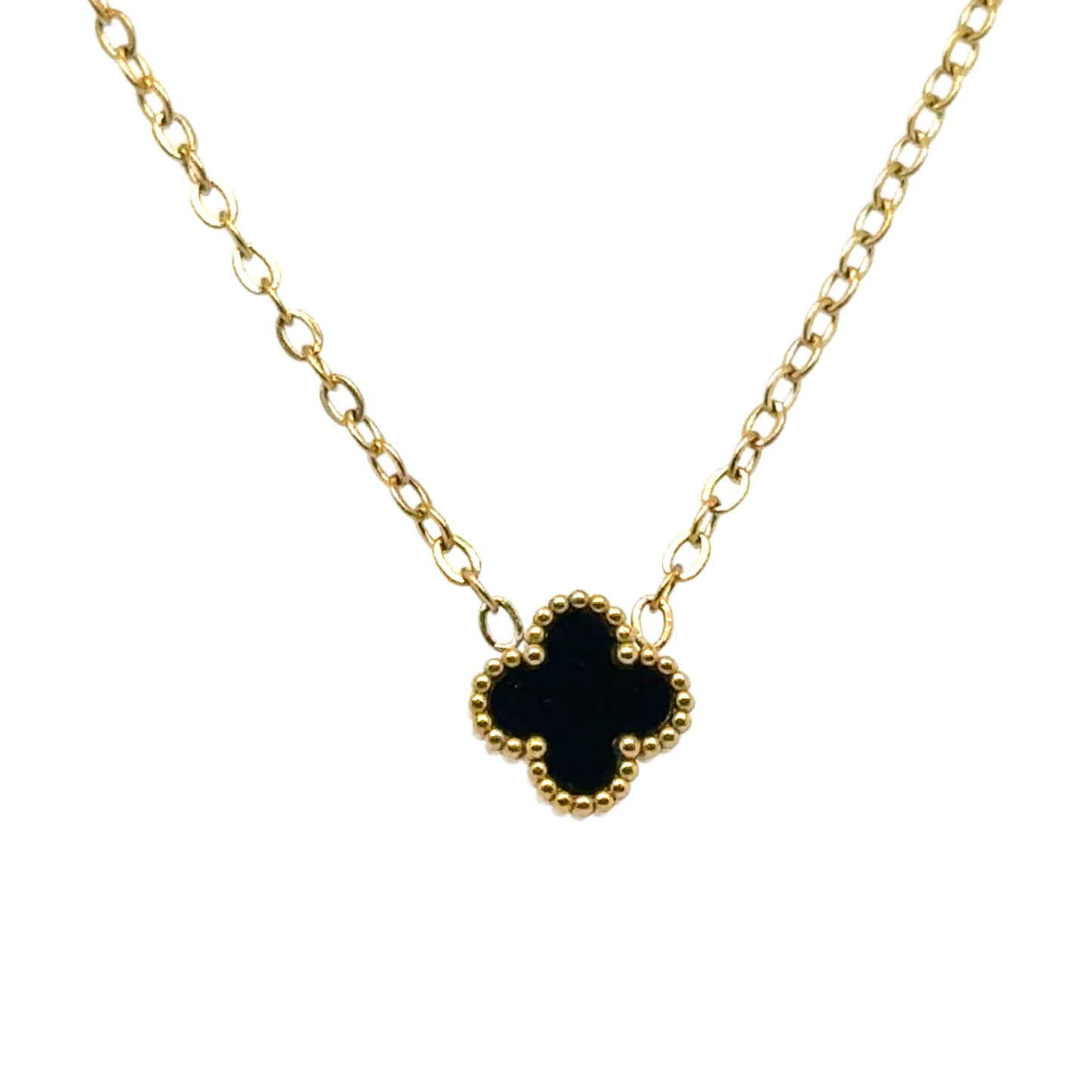 Delicate gold chain necklace with tiny 9mm black clover charm in the middle