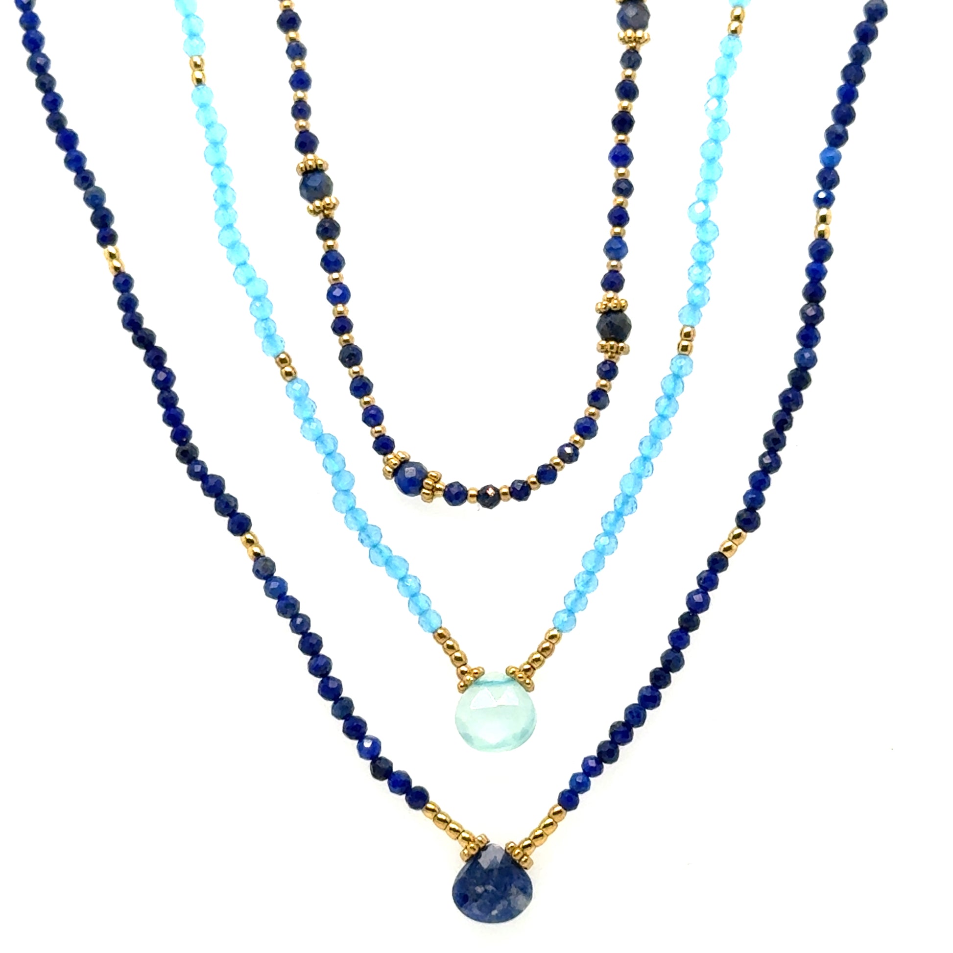 Three blue beaded necklaces with gold accents and a central pendant on a white background