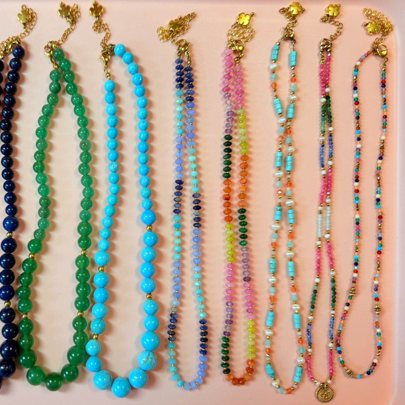 collection of colourful gemstone beaded necklaces