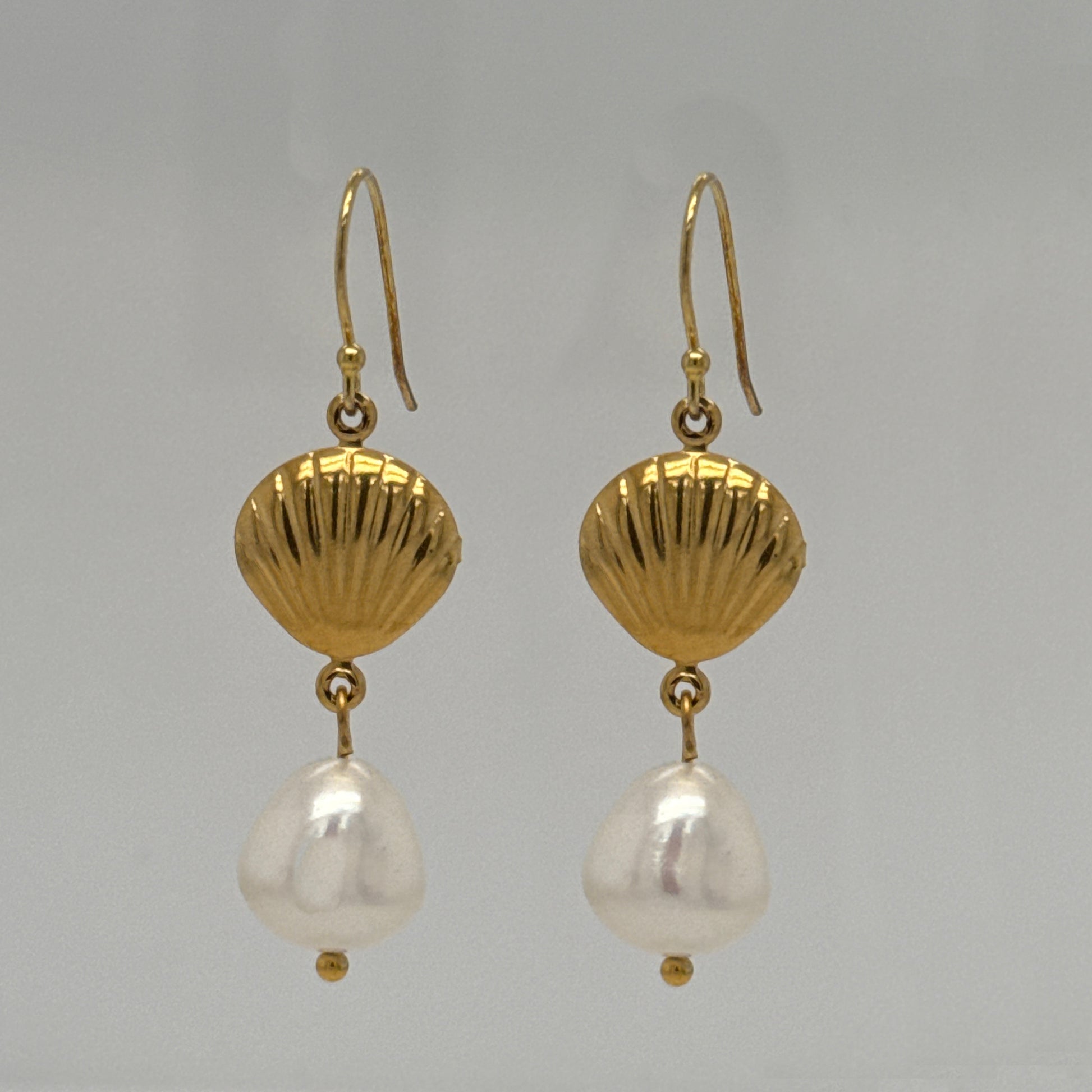 Gold filled ear hooks with one gold shell charm and a dangling large Freshwater pearl