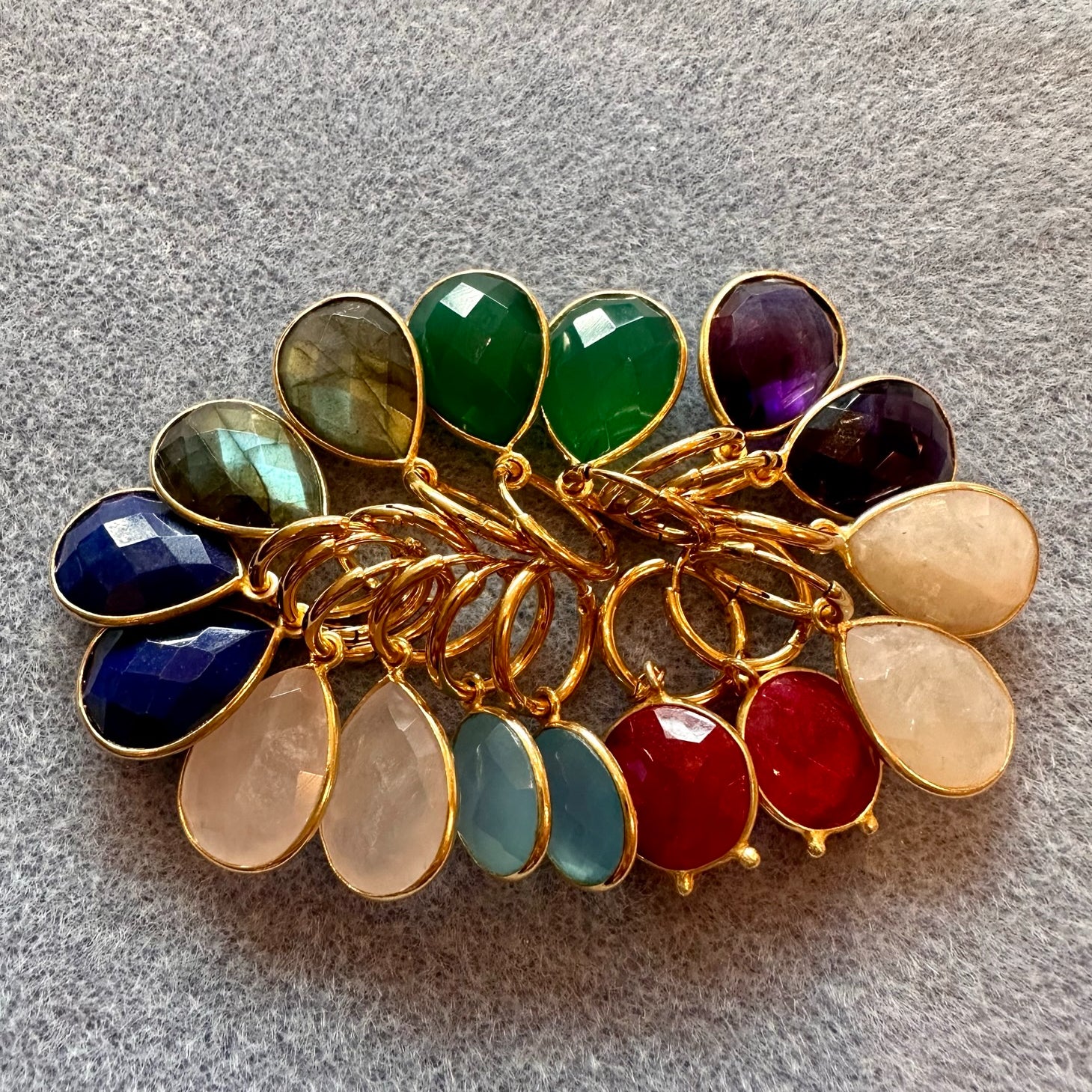 Collection of multicoloured gemstone charm hoop earrings