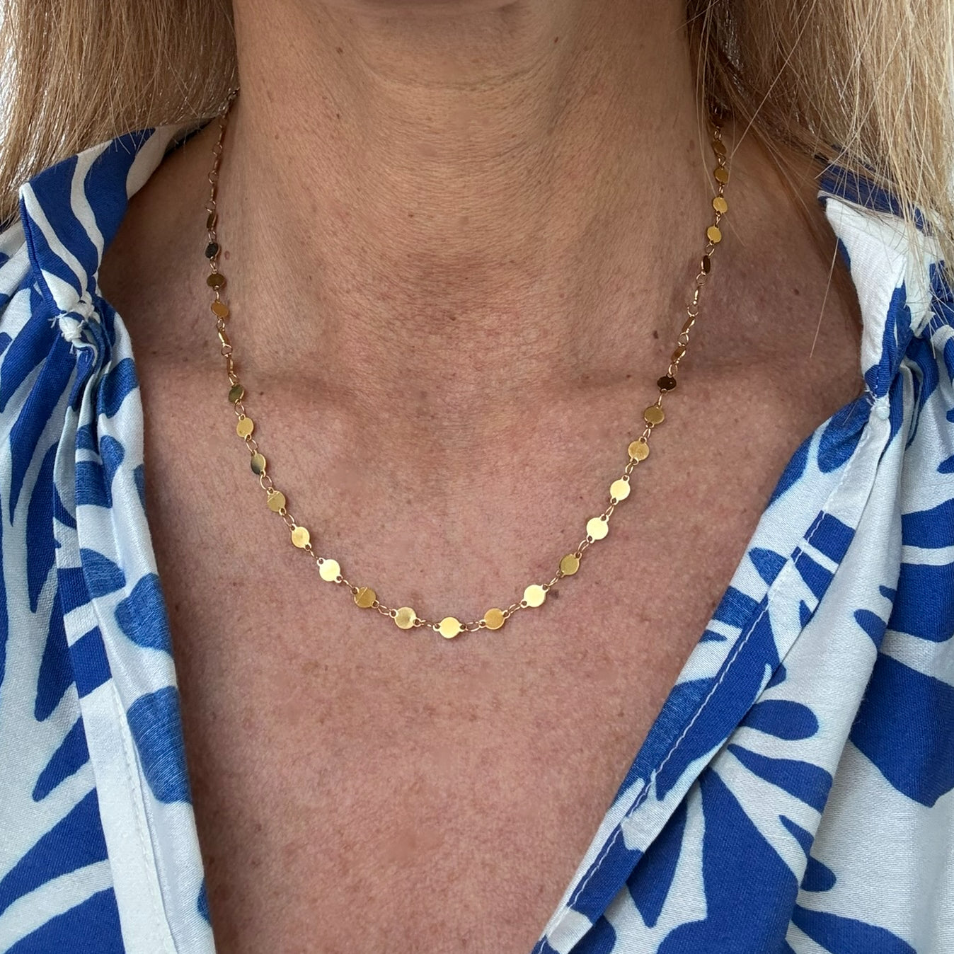 small disc chain necklace worn on model