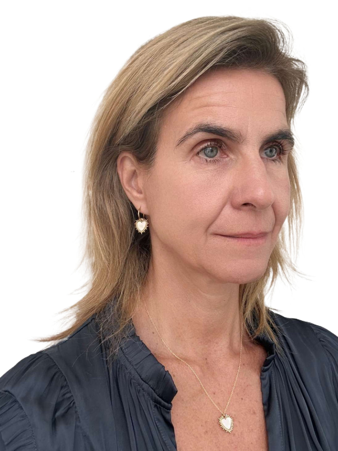 necklace with heart shaped mother of pearl and gold charm and matching earrings