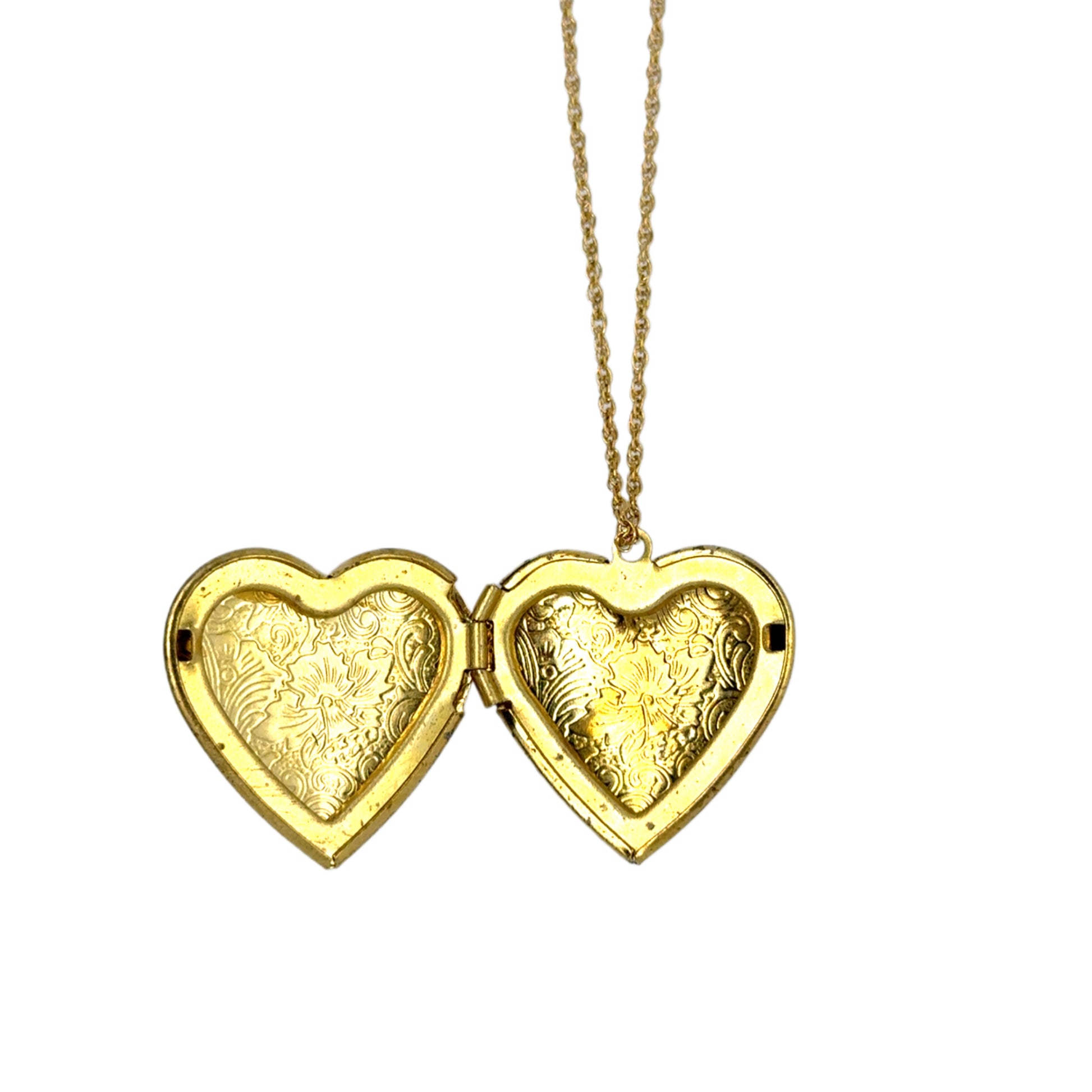 Gold heart-shaped locket on a chain against a white background shown open
