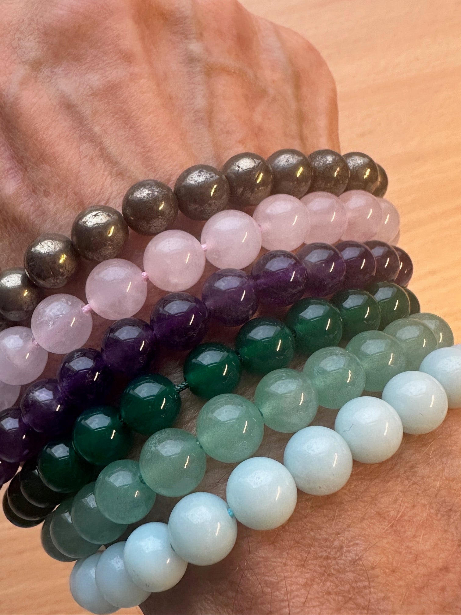 gemstone bracelets worn together