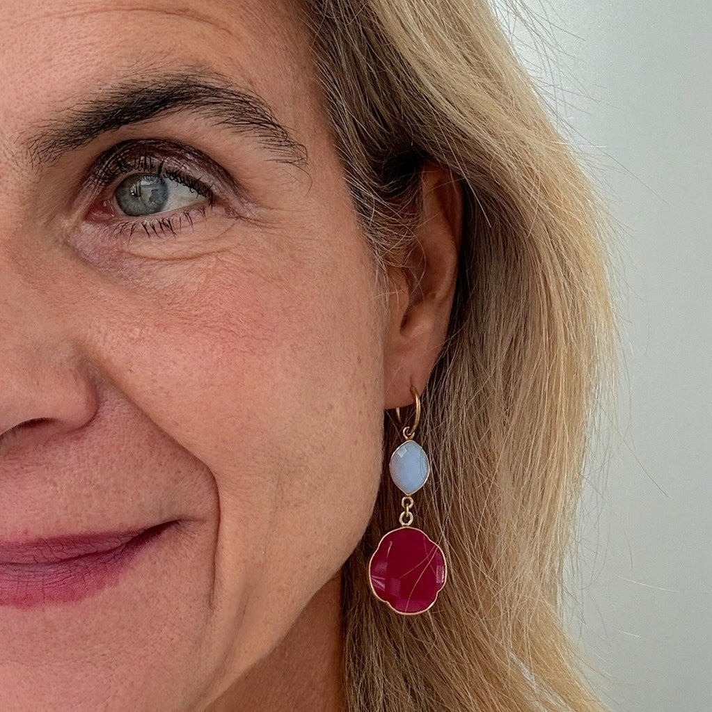 Woman wearring dangling hoop earrings with Rose Quartz and Fushia Pink Quartz gemstone charms