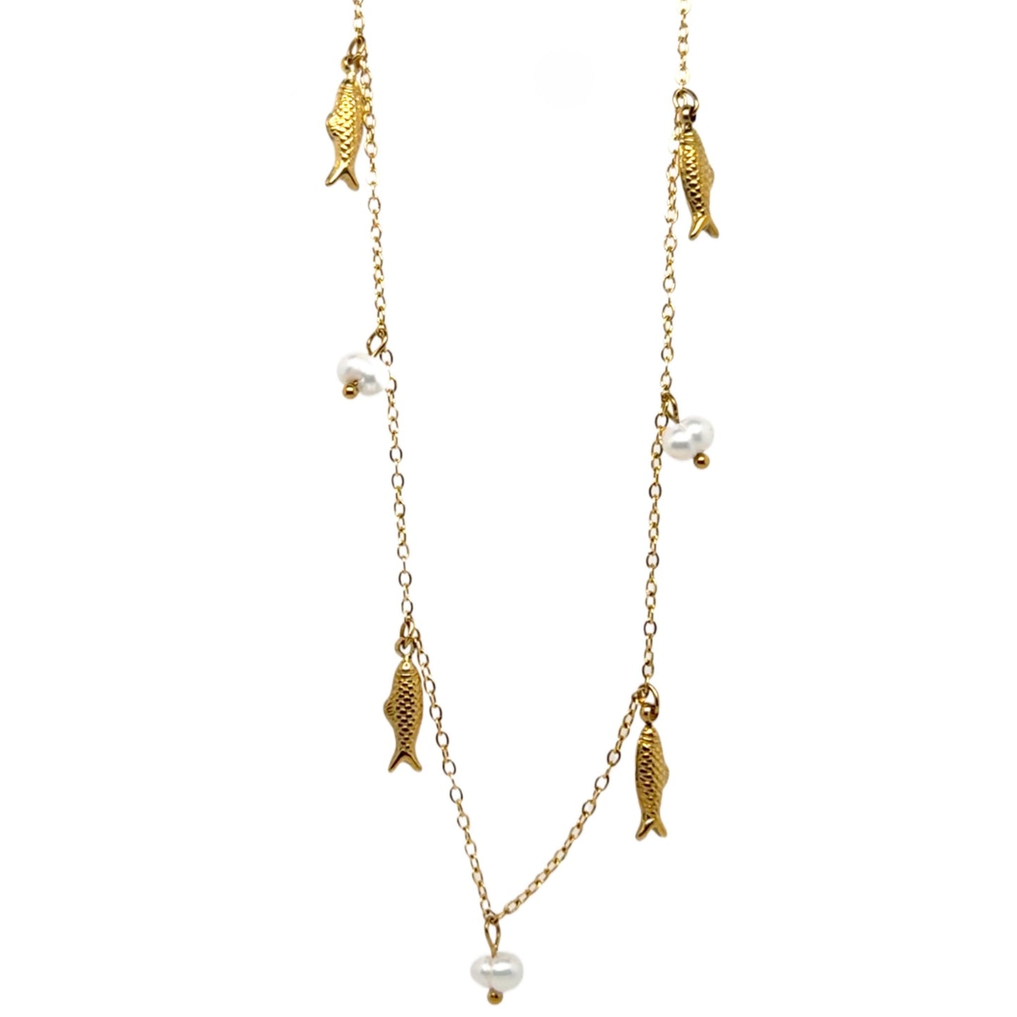 Gold fish and pearl necklace on a white background