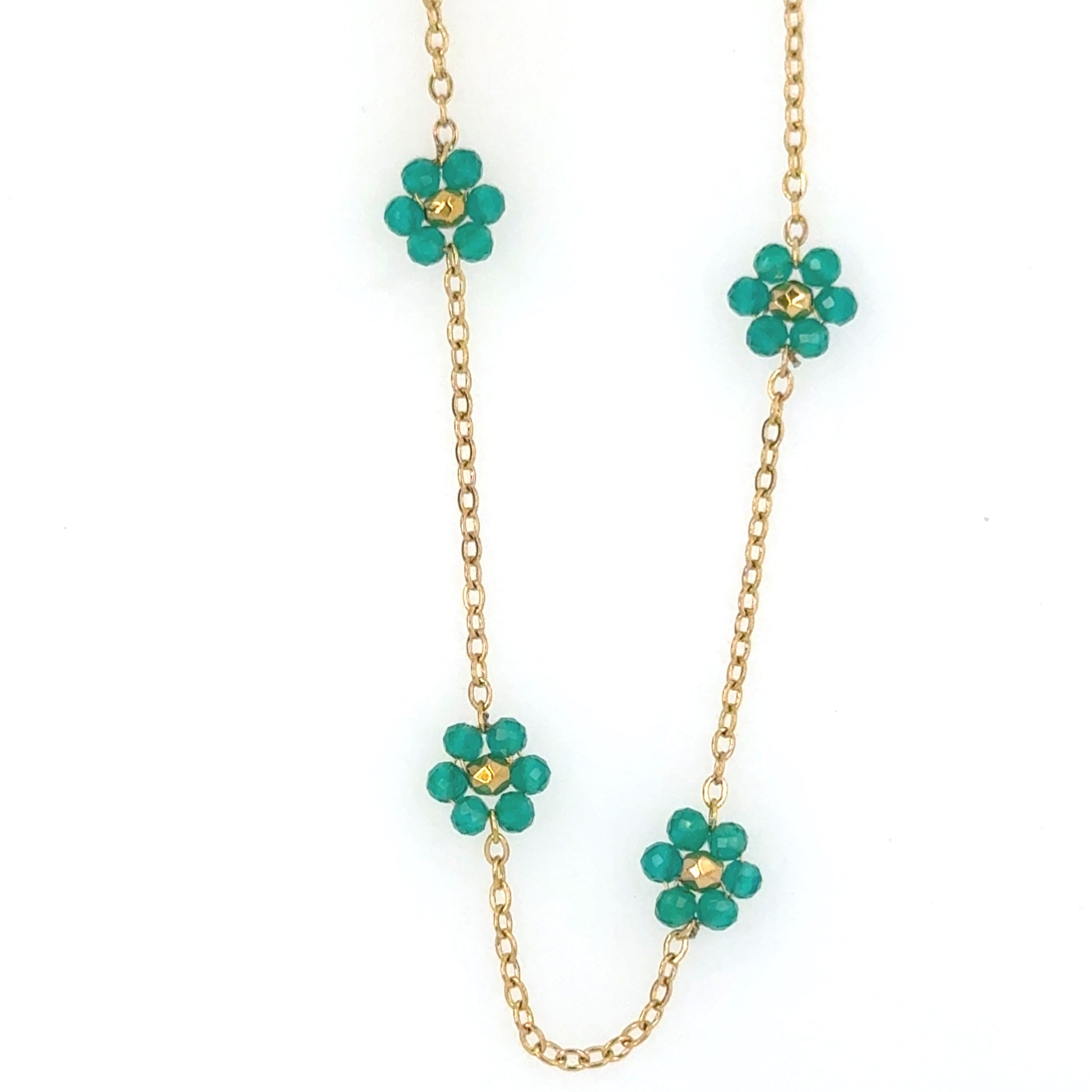 Necklace showing 4 small green and gold flowers on a delicate chain