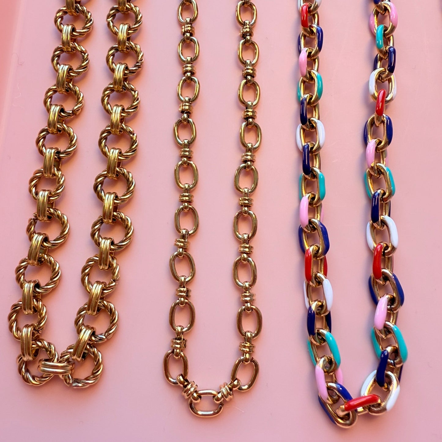Three large chain link necklaces