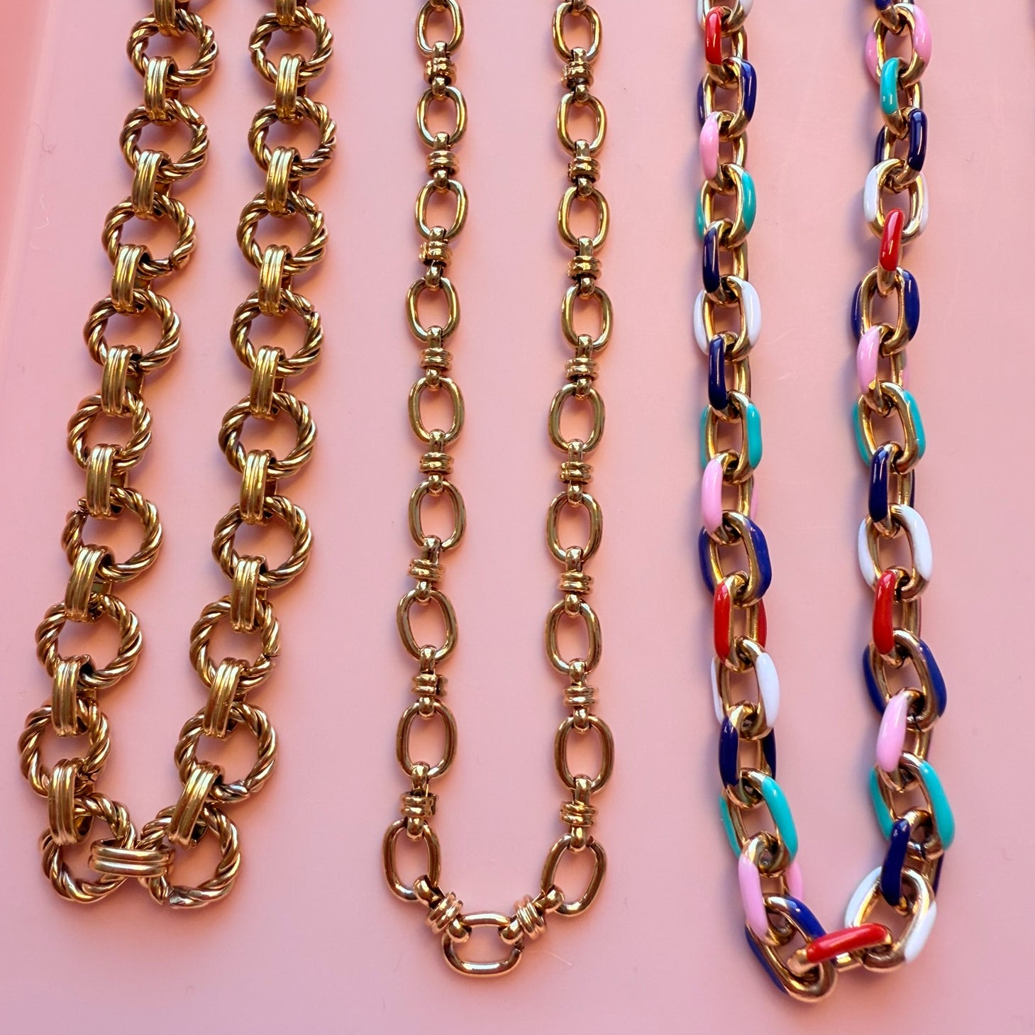 Three large chain link necklaces