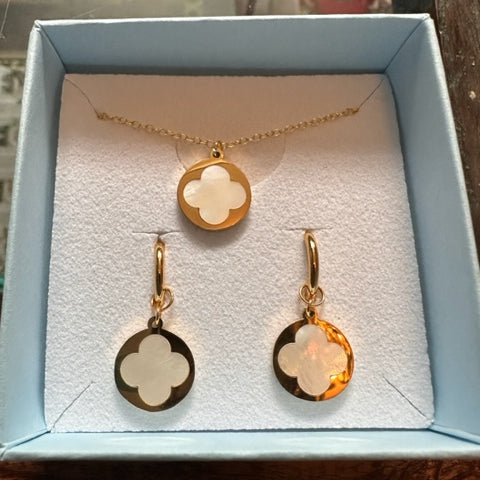 box with earrings and necklace inside both with the same gold and mother of pearl clover charms
