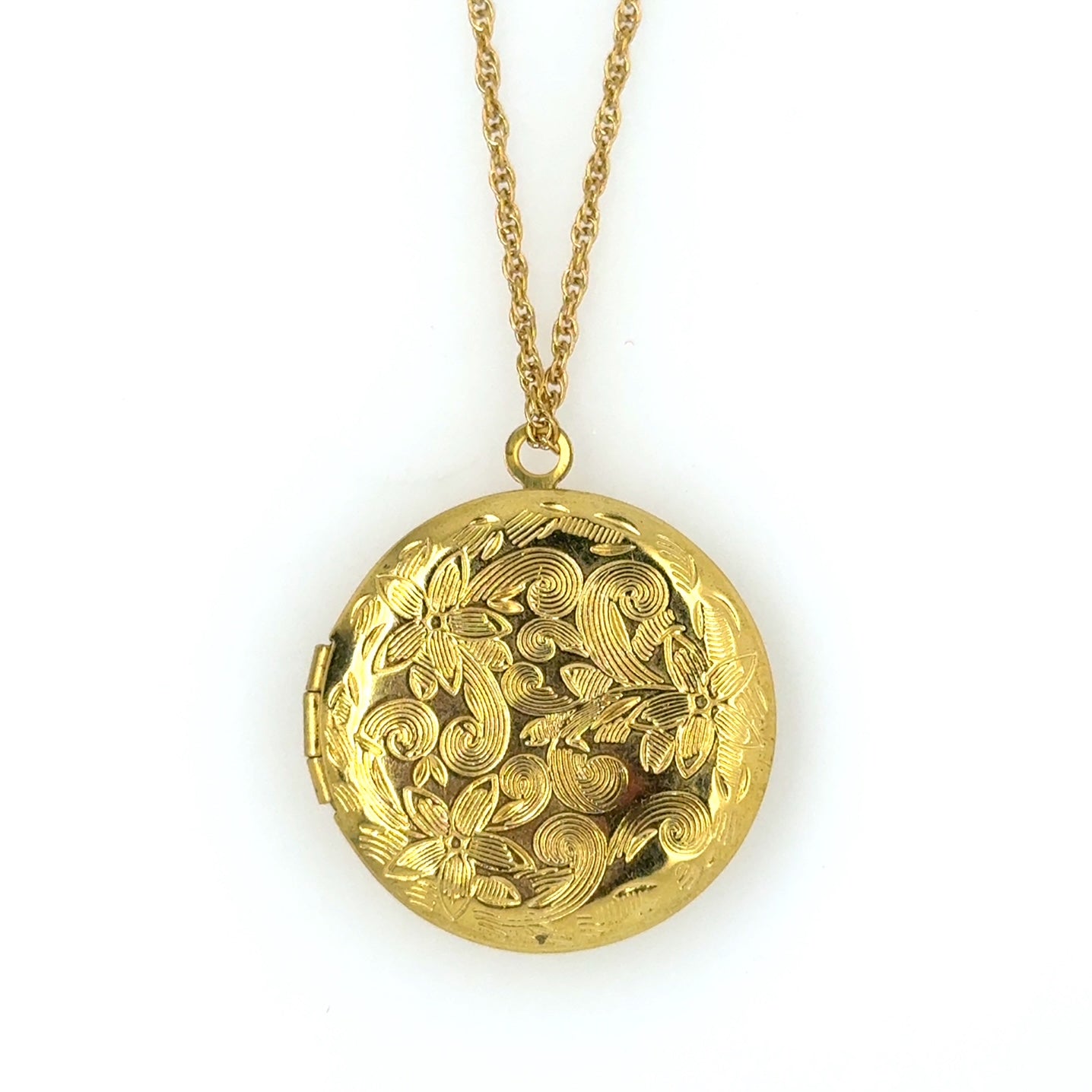 Delicate twisted belcher chain necklace with round locket with a lovely floral engracing that opens at the side and can hold two little photos