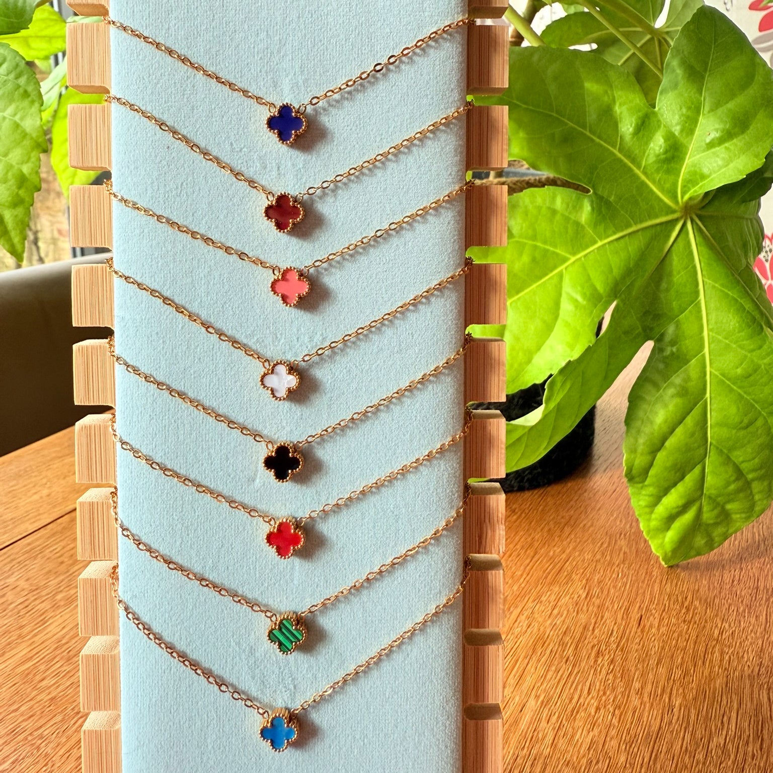 Gold necklaces with tiny clovers in 8 different colours