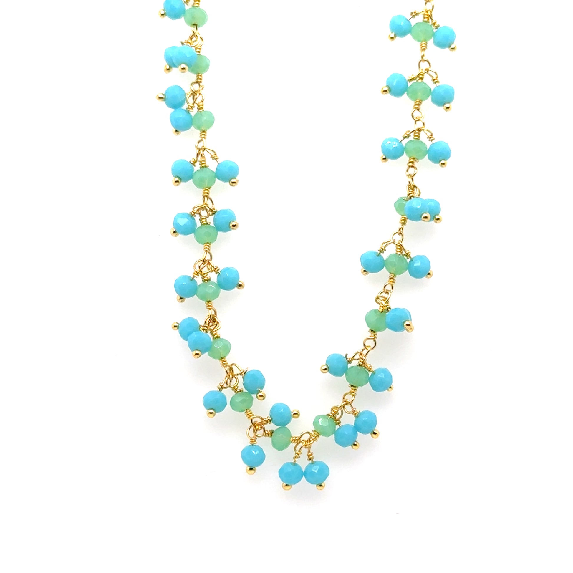 Gold necklace with bright blue Aquamarine and green Prehnite gemstone beads arranged in clusters
