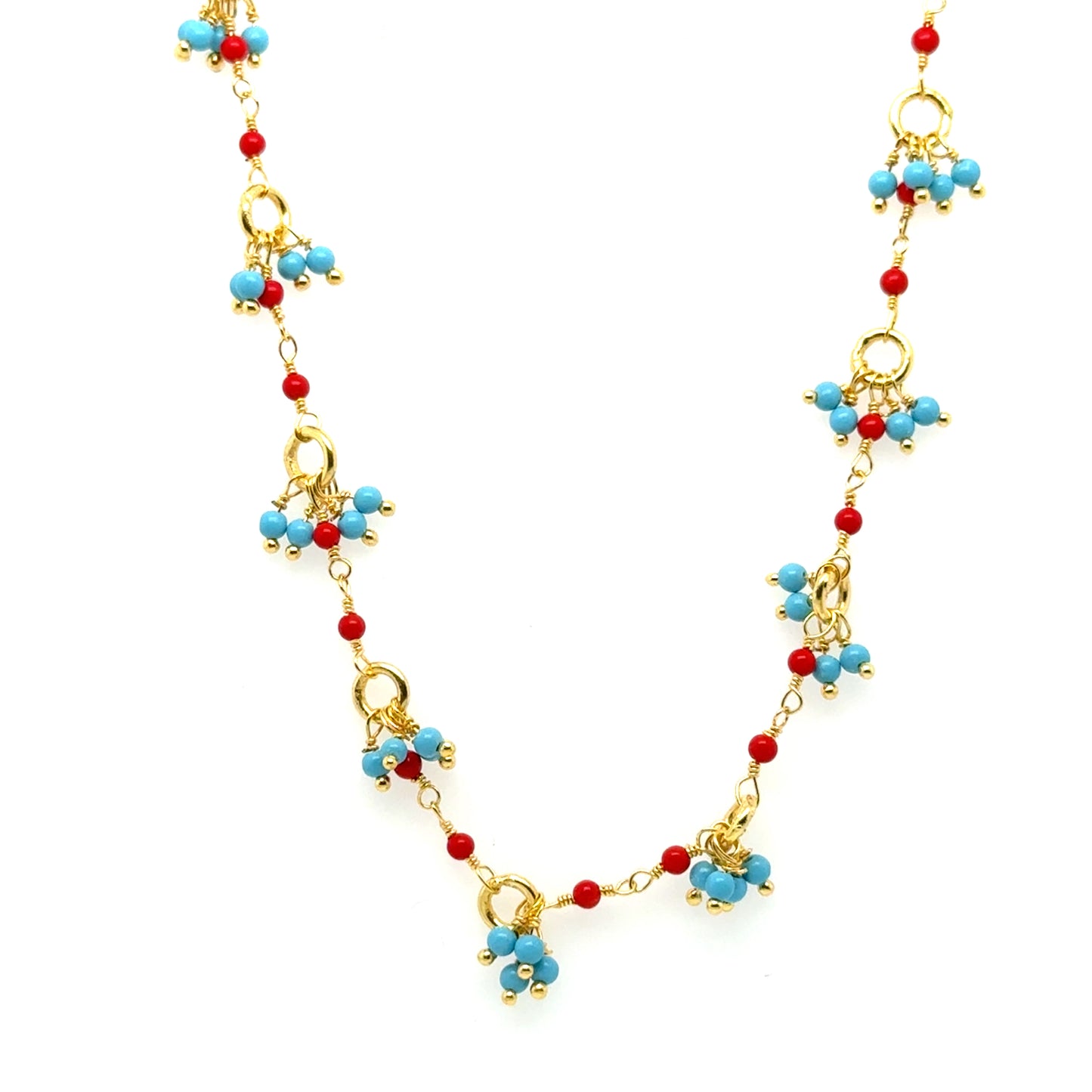 Gold necklace with bright Turquoise and red Coral gemstone beads arranged in clusters
