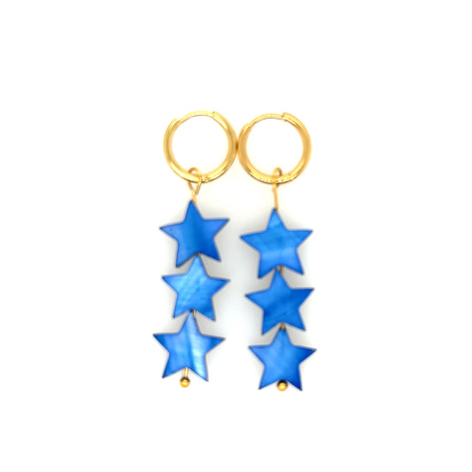 gold hoop earrings with blue star shaped charms in mother of pearl