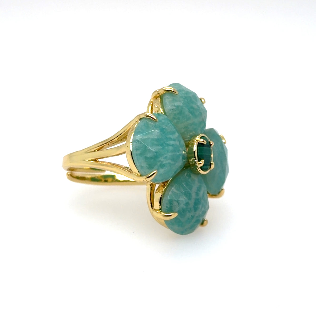 A gold ring featuring four textured light blue-green gemstone petals with a small dark green center stone, set against a plain white background. Adjustable ring.