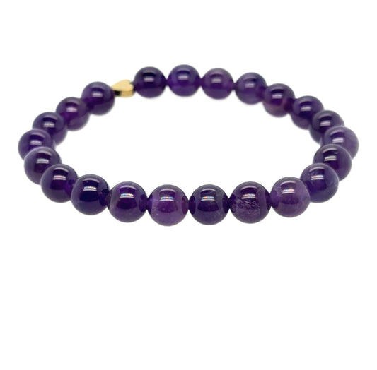 This bracelet is made with 8mm Amethyst gemstones and a small Hematite heart bead on a strong stretchy elastic