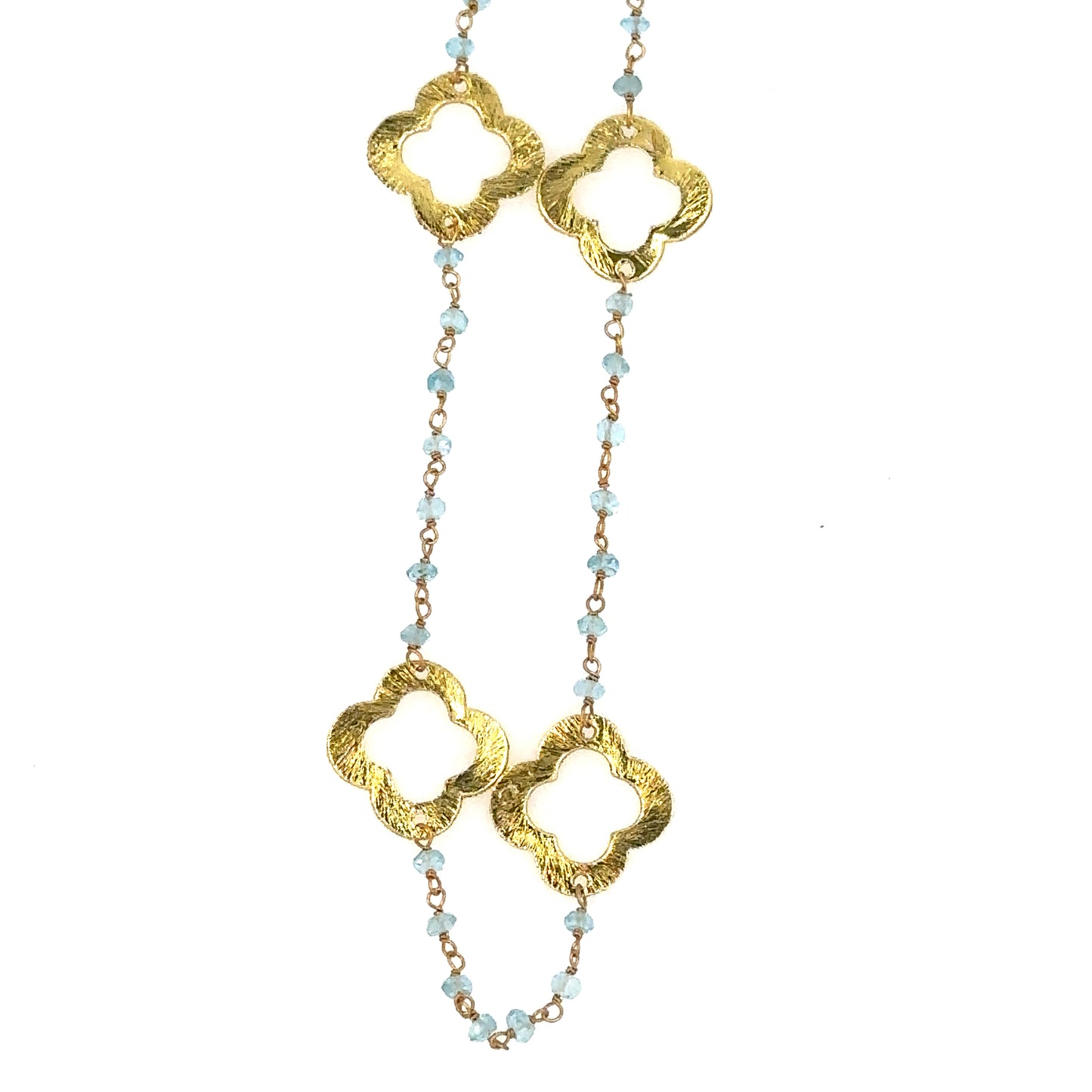 Light blue Apatite gemstone rosary chain with flat gold clover charms showing 4 charms