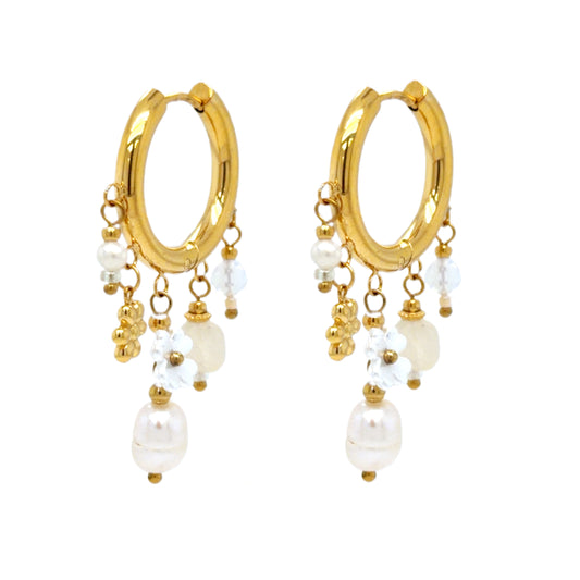Medium sized gold hoop earrings with five pearl and crystal charms