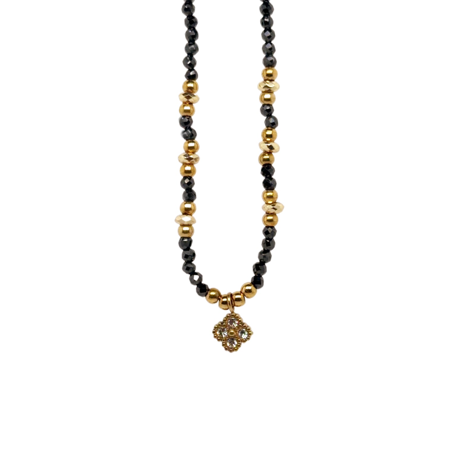 becklace with clover charm and black/gold beads all around