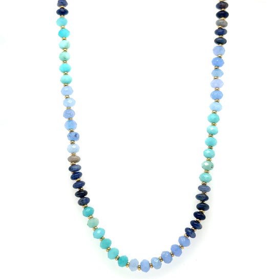 Necklace with blue and green beads on a white background