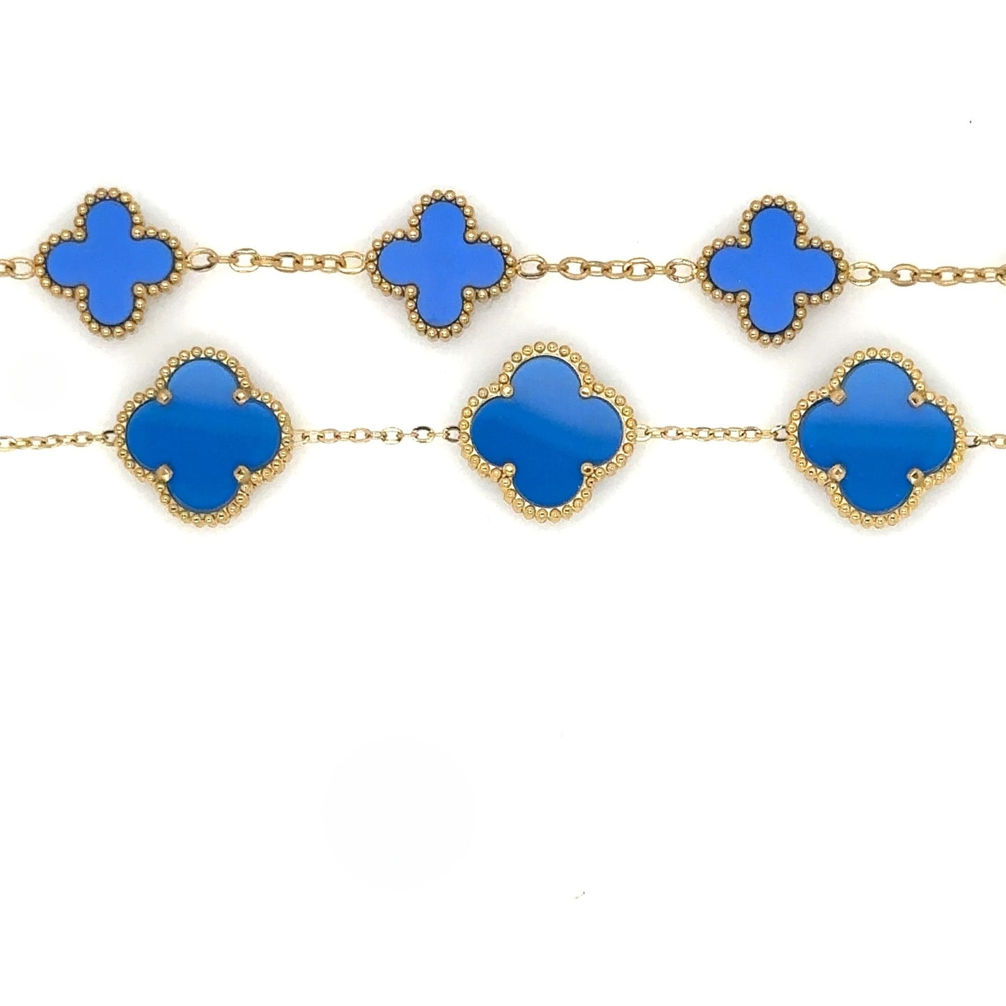 two gold bracelets with small and large clover charms in blue enamel