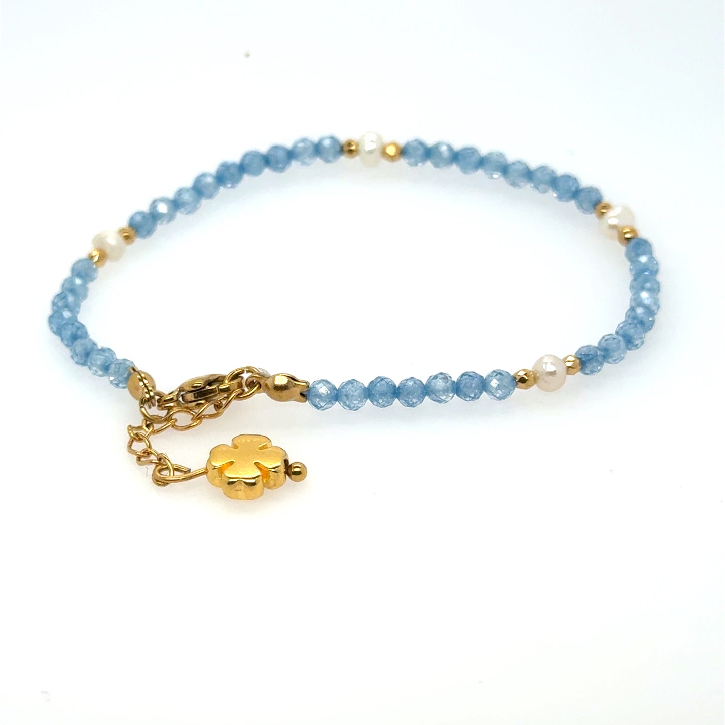 Delicate bracelet with tiny blue beads and freshwater pearls and gold clover for luck!