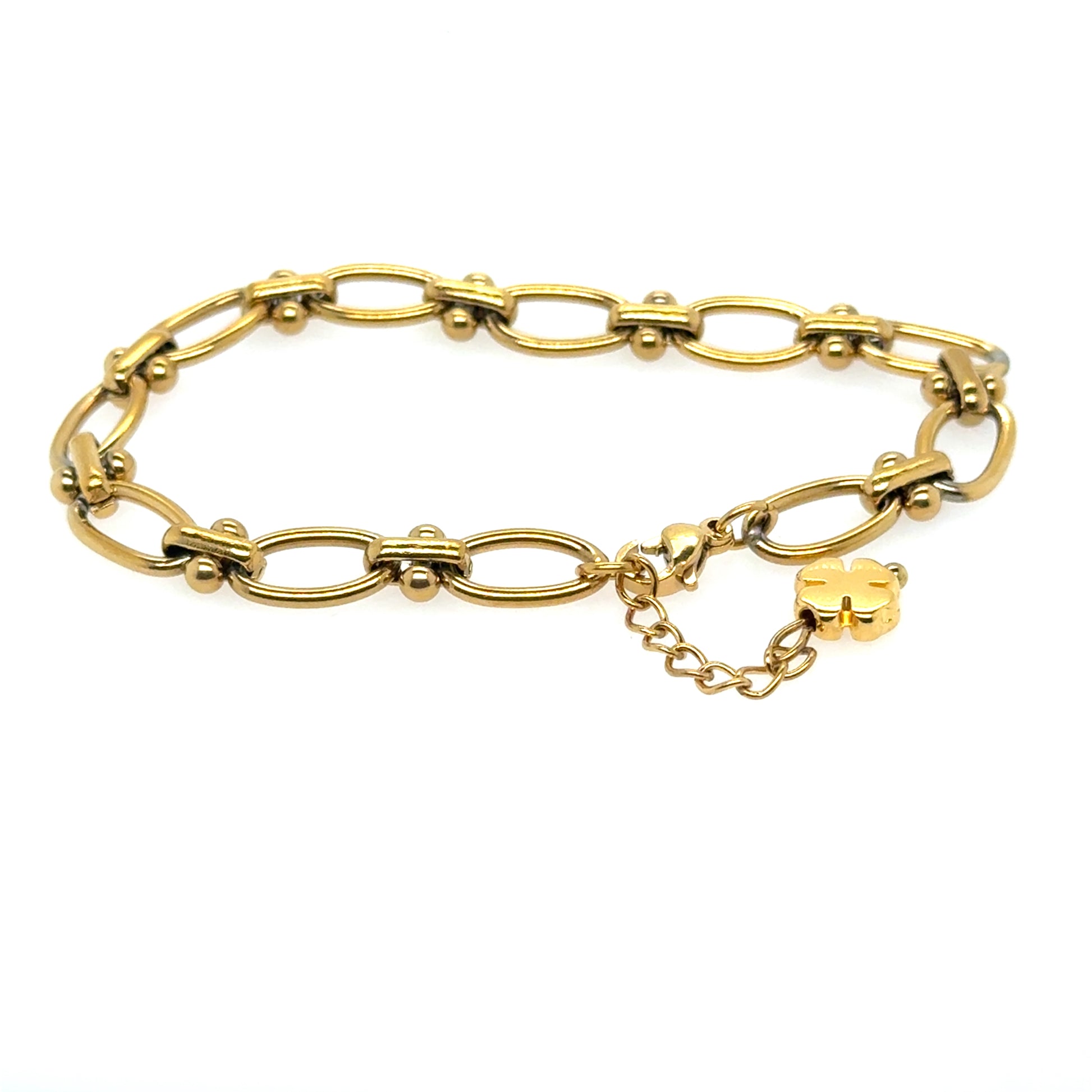 This gold bracelet has a gorgeous oval link design and small gold clover for luck