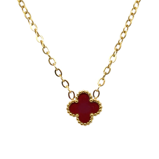 Delicate gold chain necklace with tiny 9mm burgundy clover charm in the middle