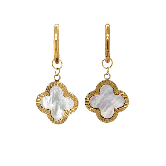Delicate gold hoop earrings with large clover shaped mother of pearl charms
