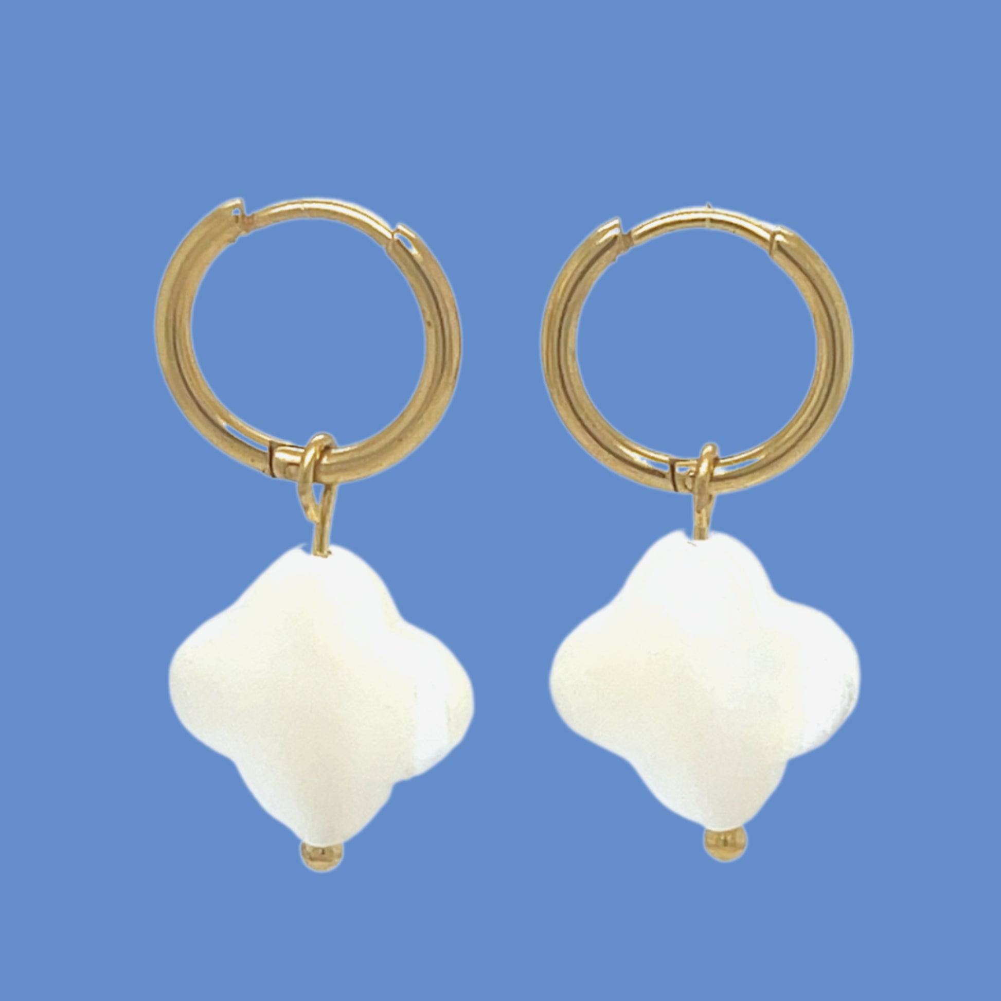 gold hoop earrings with clover shaped white mother of pearl shell charms