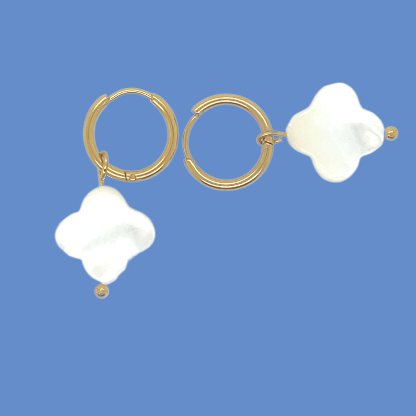 gold hoop earrings with clover shaped white mother of pearl shell charms