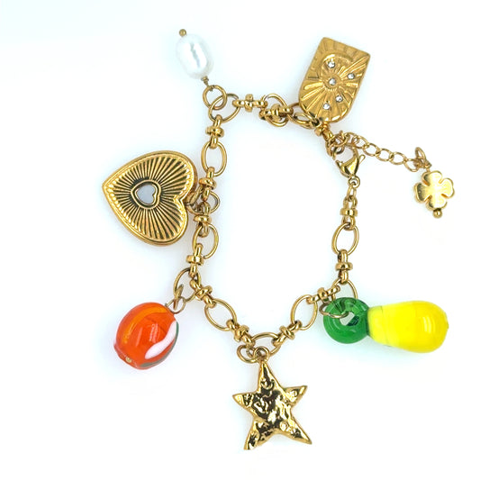 This lovely chunky bracelet has 6 dangling gold or glass charms inclusing a lemon, a heart and a freshwater pearl