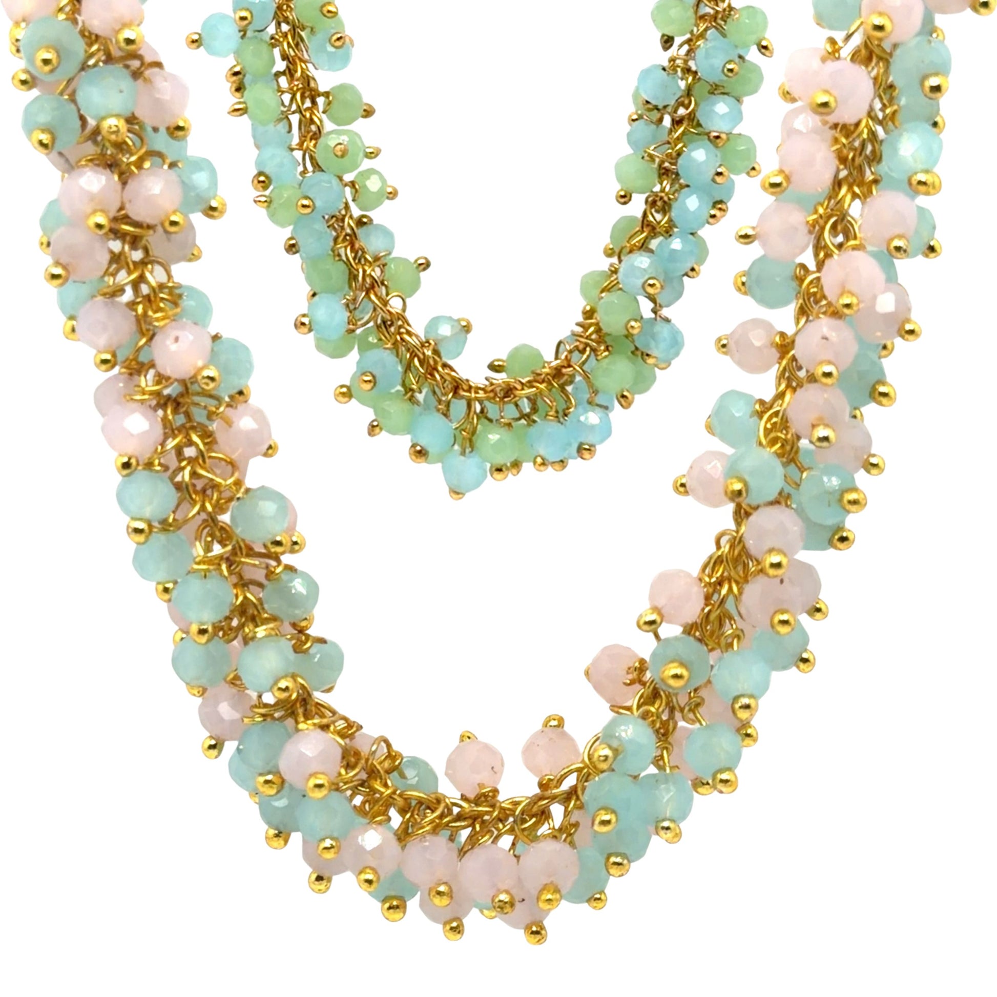 Multistrand necklace with gold chain, light blue, and pink beads on a white background