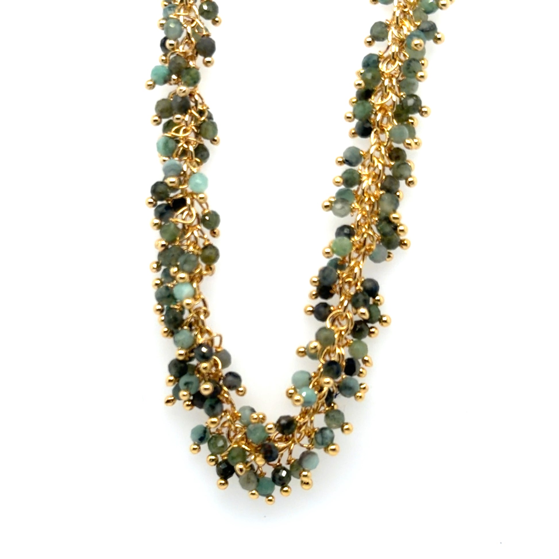 Necklace with green beads and gold chain on a white background