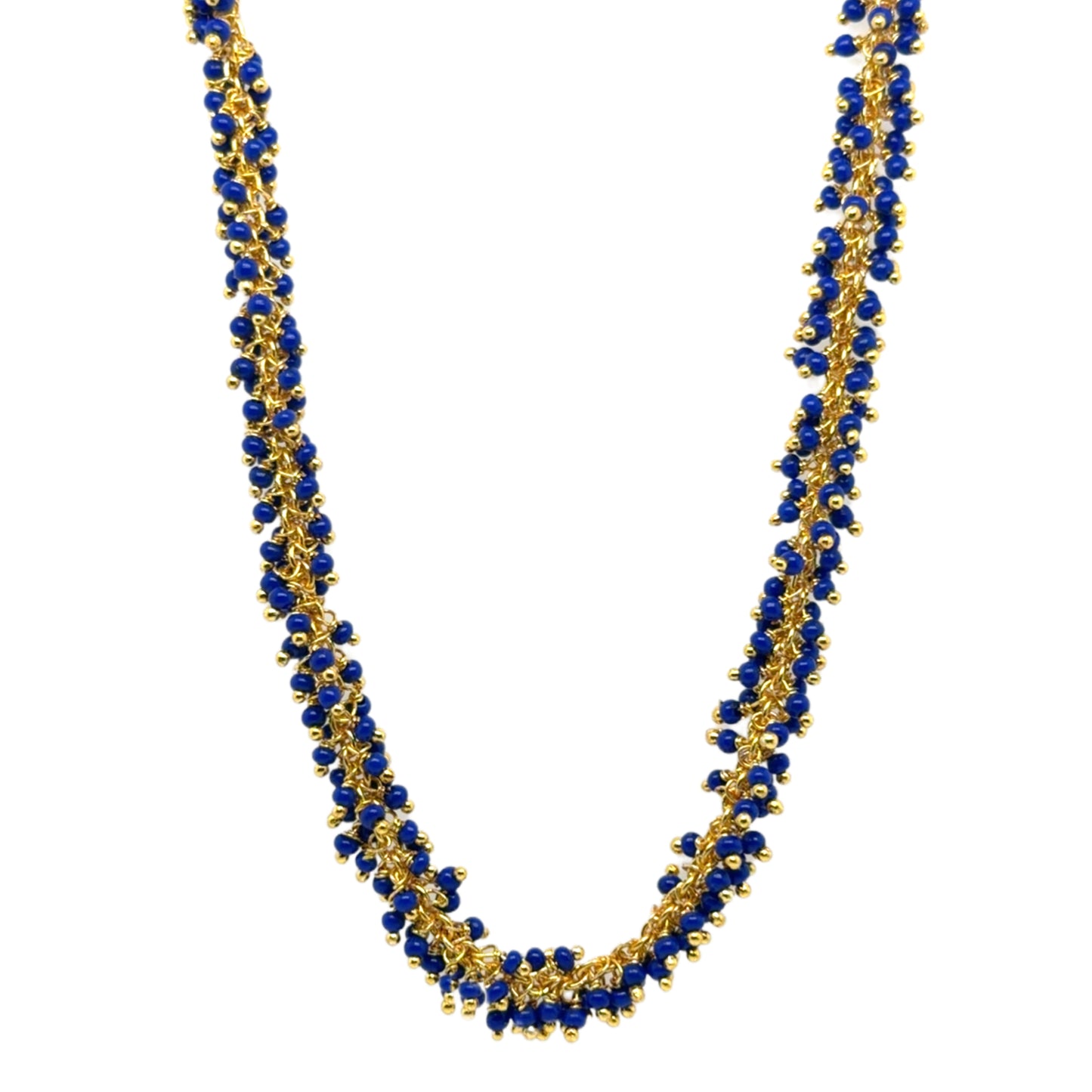 Delicate gold hoops with bright navy blue glass beads arranged in dangling clusters