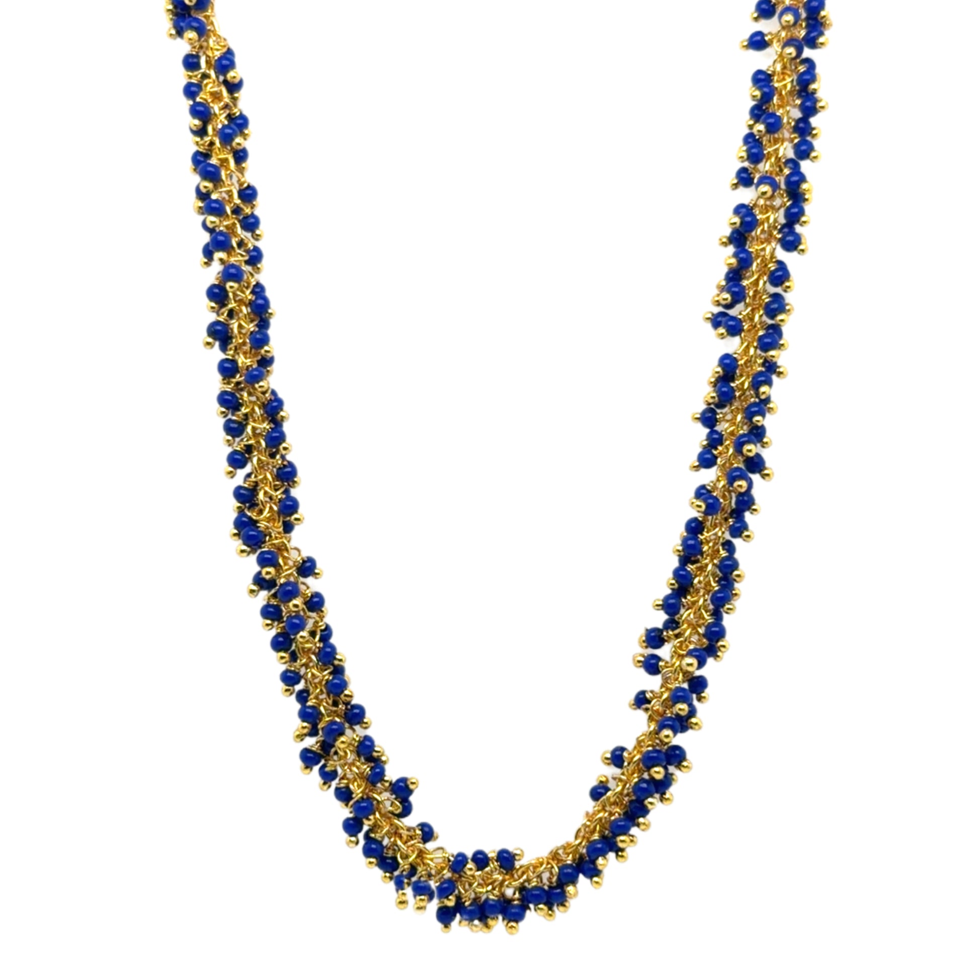 Delicate gold hoops with bright navy blue glass beads arranged in dangling clusters
