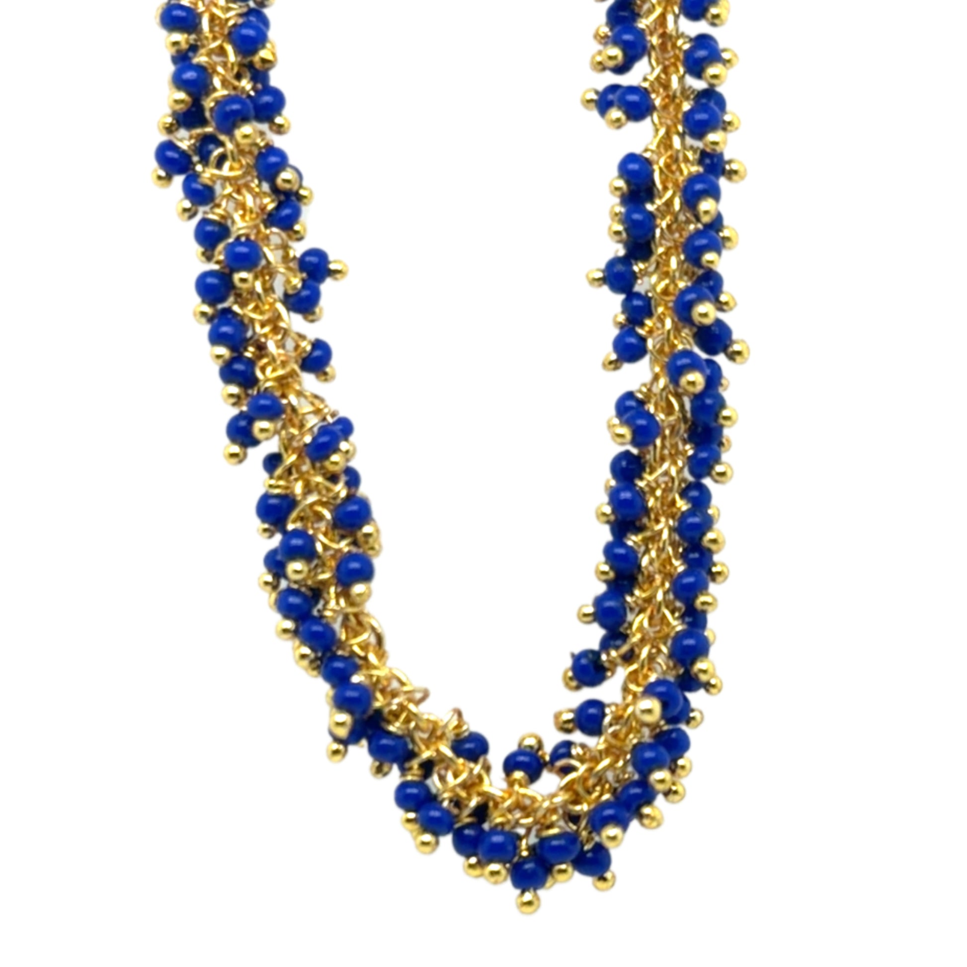 Necklace with blue beads and gold accents on a white background