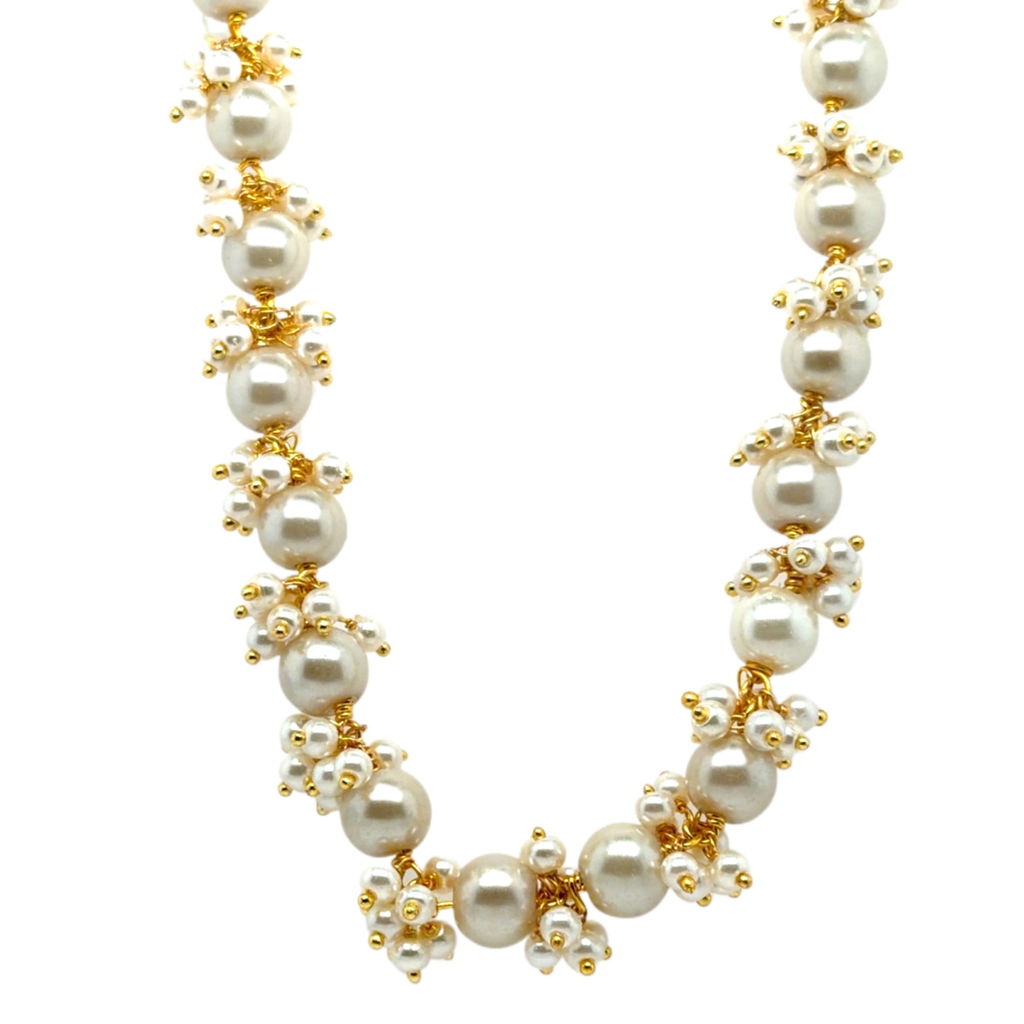 Pearl necklace with gold accents on a white background