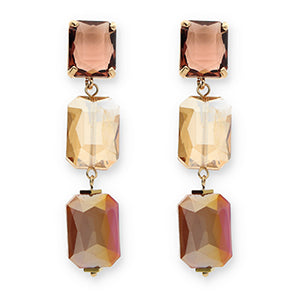 Pair of earrings with multicolored gemstones on a white background