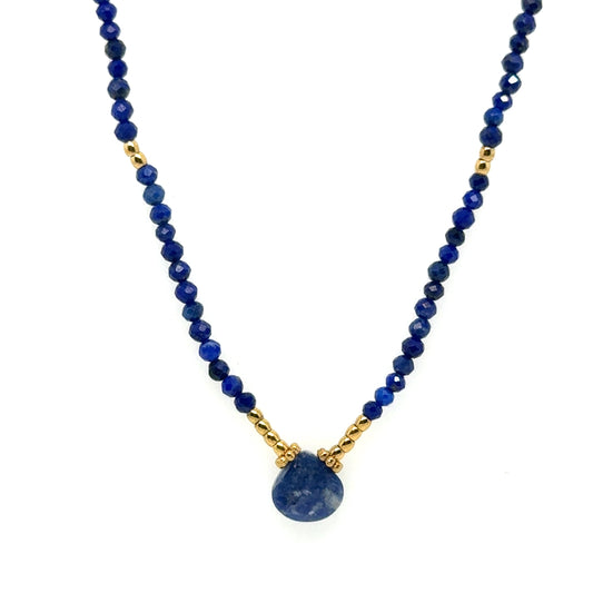 Delicate necklace with tiny dark blue and gold beads, and lovely Lapis Lazuli gemstone in the middle