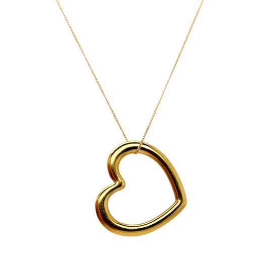 Thin delicate gold chain necklace with one large gold heart charm