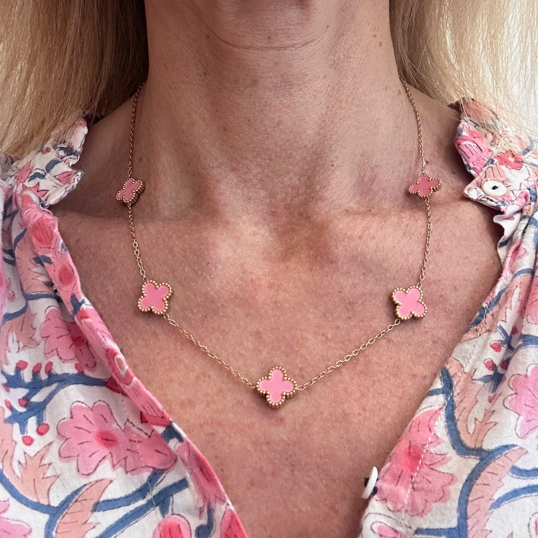 Necklace with five small pink clover charms