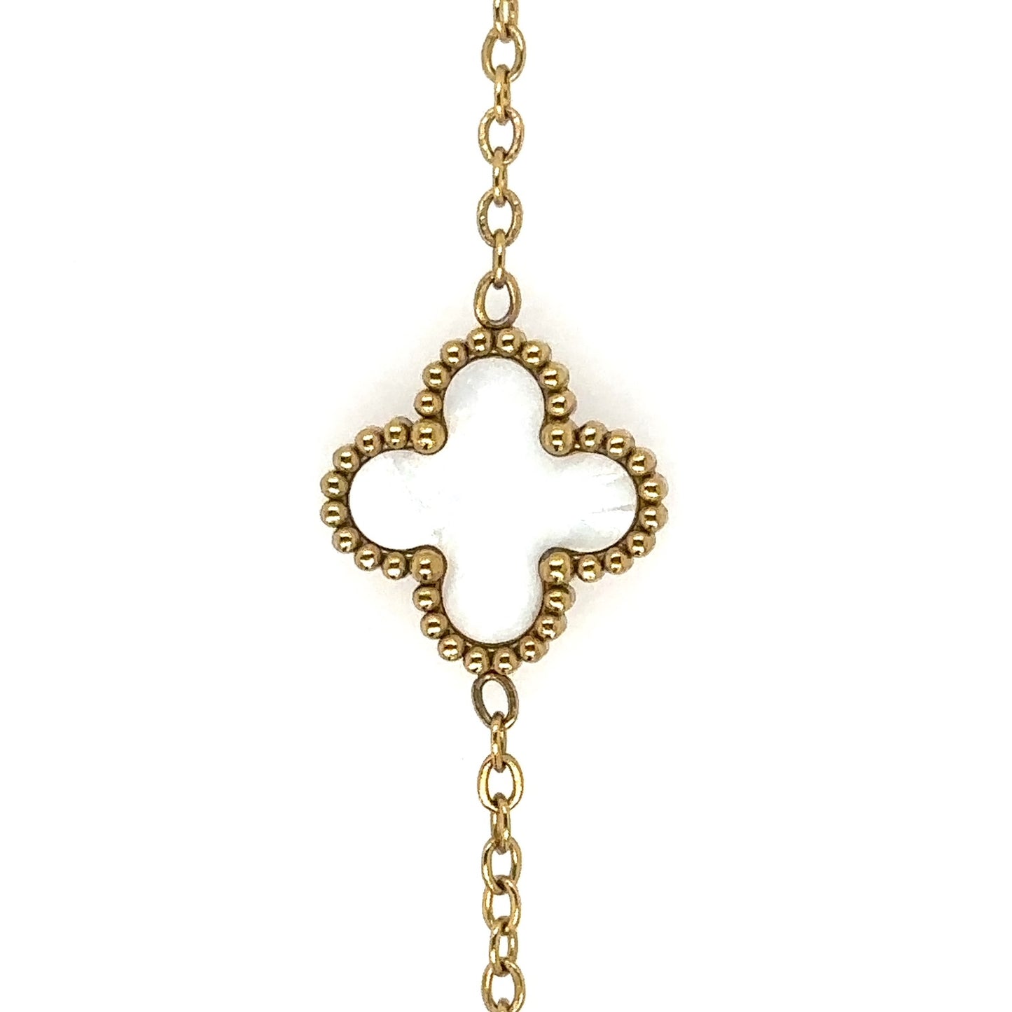 Gold chain necklace with small white mother of pearl clover