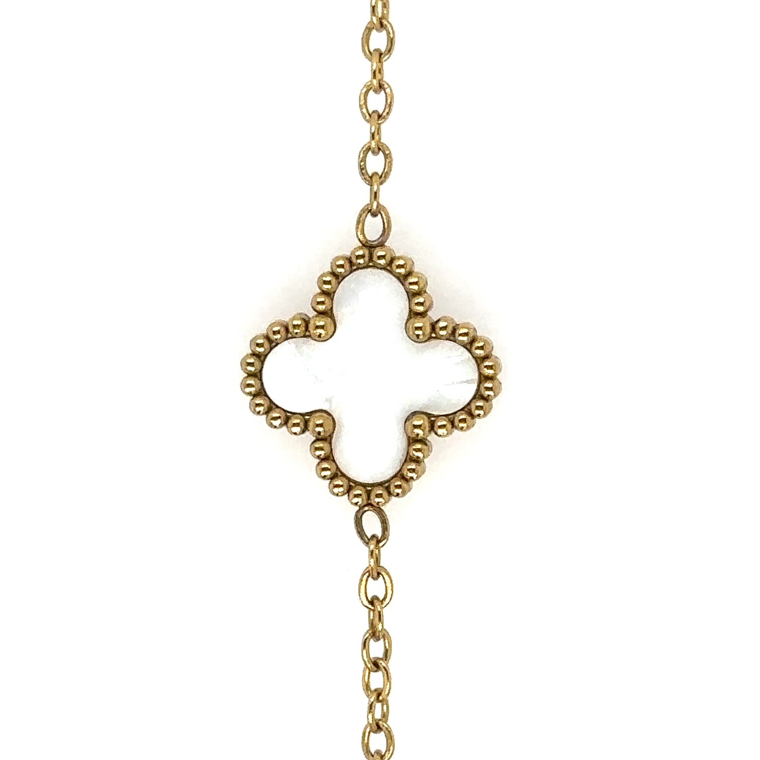 Gold chain necklace with small white mother of pearl clover