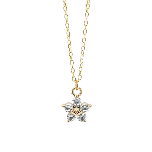 Delicate gold chain necklace with sparkly flower shaped charm