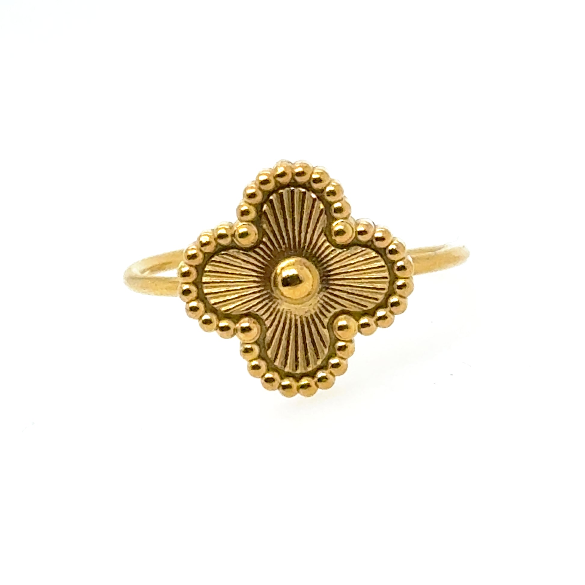 Gold ring with gold clover design on a white background